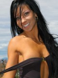 Trista strips off her sexy black body suit outdoors
