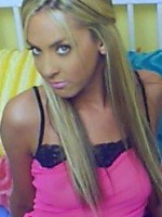 Ashley in a bright pink sheer top