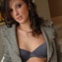 Melanie is slowly stripping out of her clothes after a long day at the office