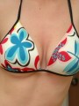 Amys huge boobs are popping out of her bikini top